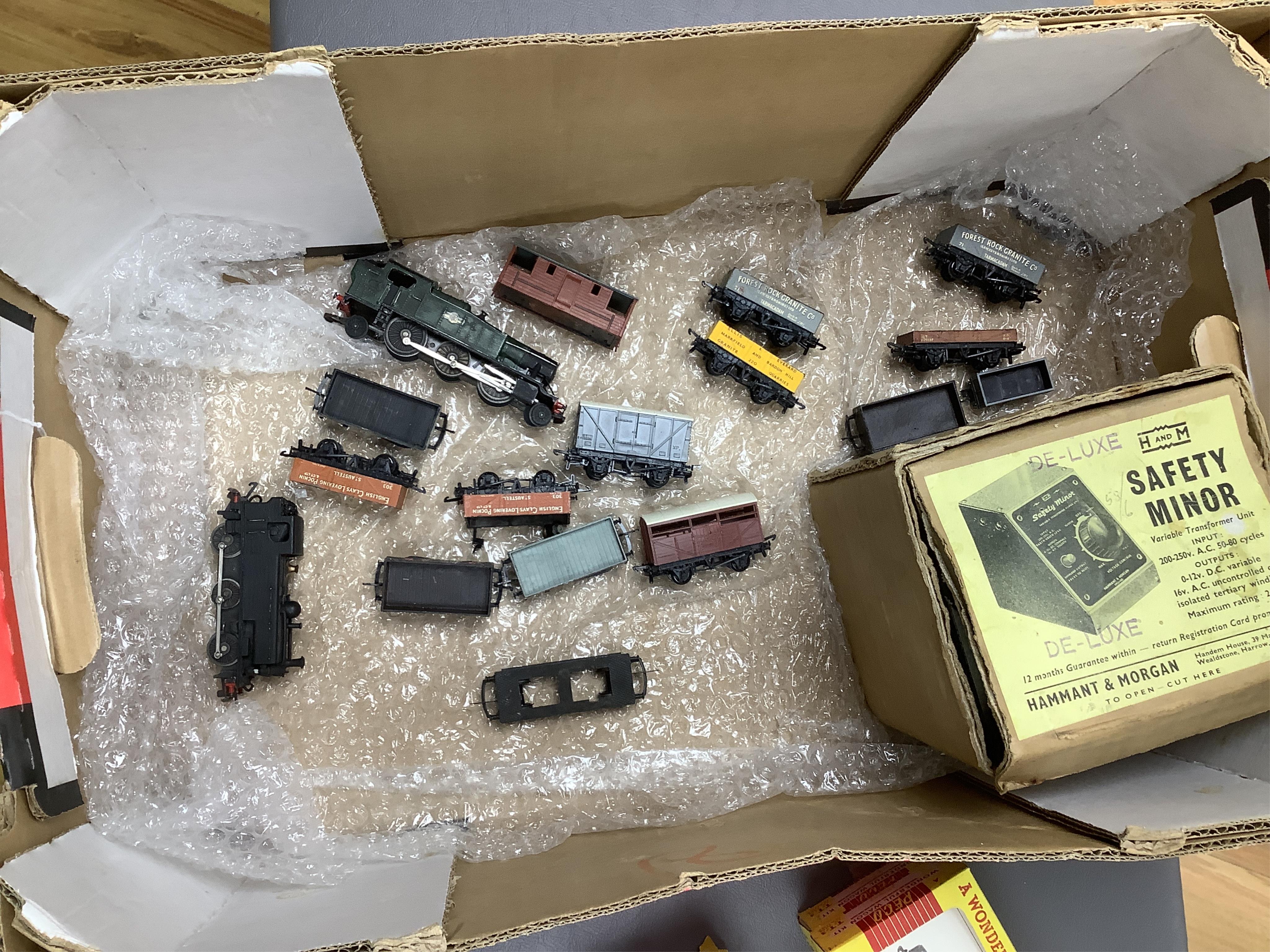 Fifteen items of TT gauge model railway by Peco, etc. including two white metal kit-built locomotives; a BR Prairie tank and a GWR 0-6-0T, together with 13 mainly kit built freight wagons, etc. Condition - fair, some rep